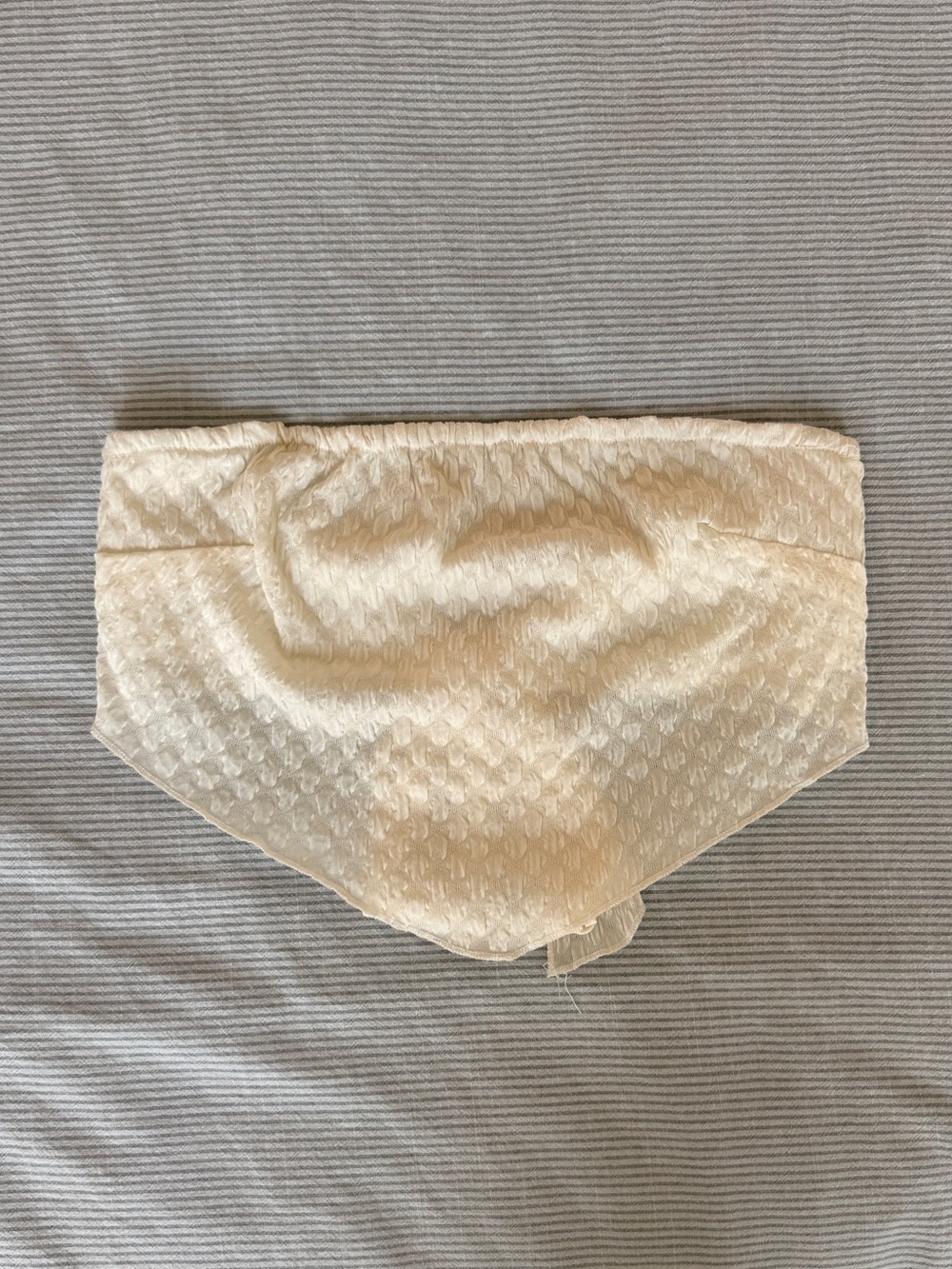 Cream textured strapless bandeau top with adjustable tie in the back, Size S